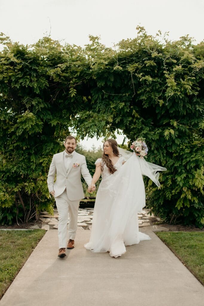 Romantic outdoor wedding reception at Hillside Farms barn wedding venue in Olympia Washington with the greenery arch