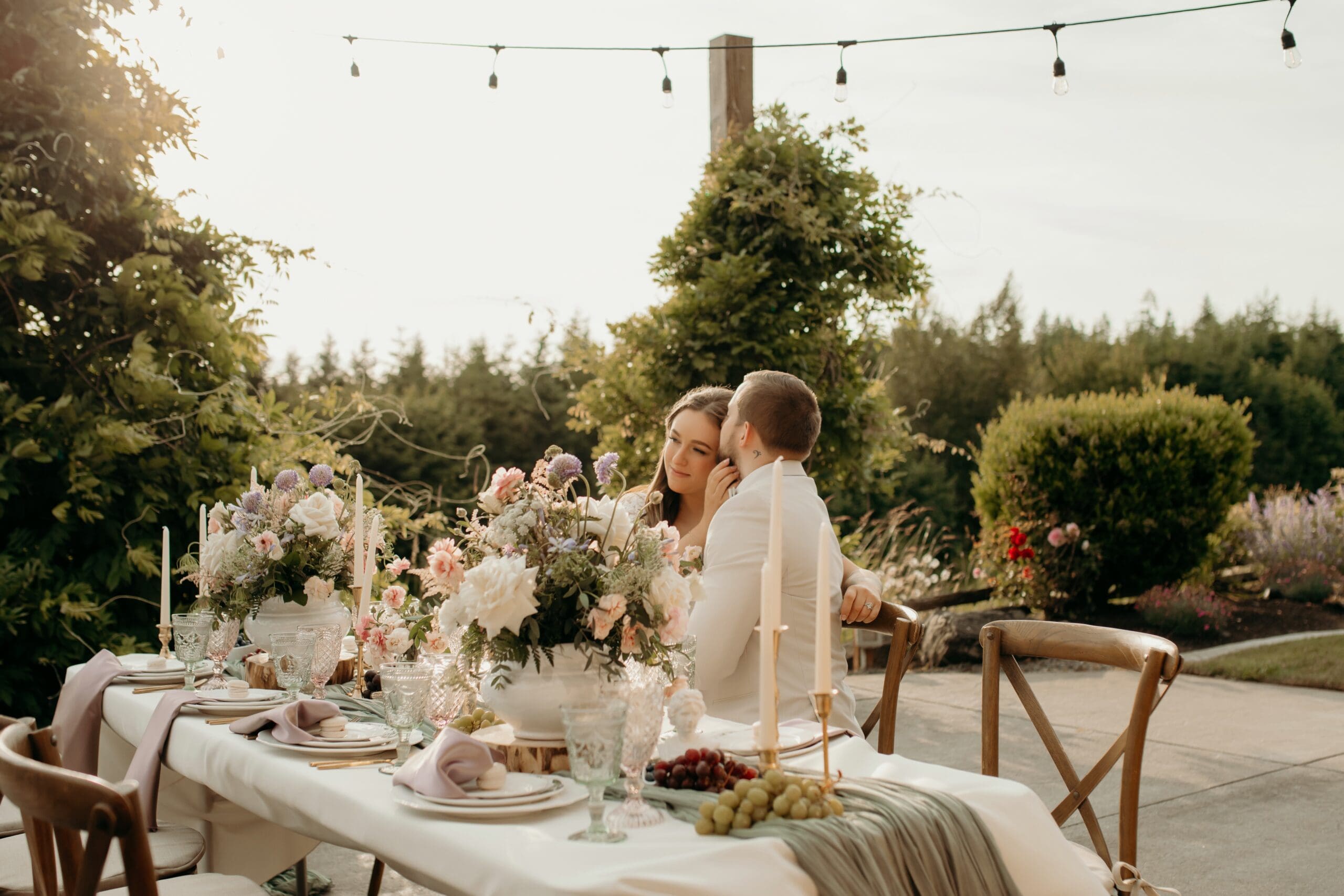 Romantic outdoor wedding reception at Hillside Farms barn wedding venue in Olympia Washington with string lights and sweetheart table